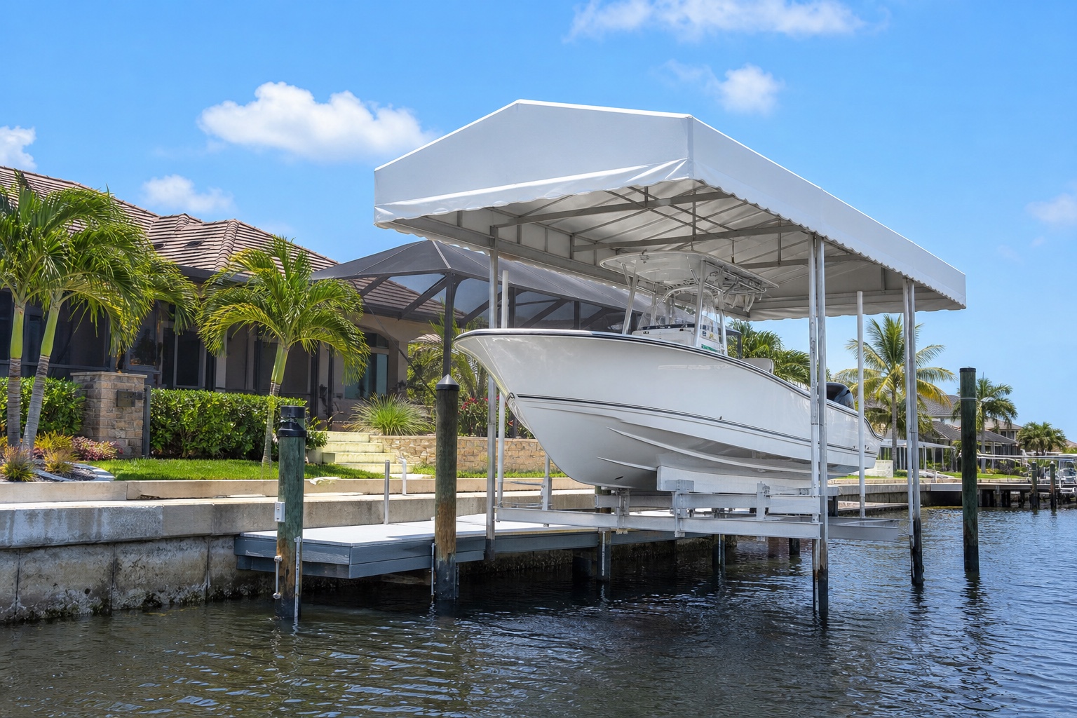 Covered boat lift with canopy holding a center-console on a canal